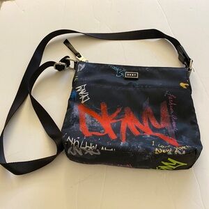DKNY fabric black crossbody bag with red/multicolored graffiti print